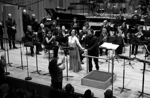 April Fredrick as Jane and David Stout as Rochester receive audience applause at the end of the concert premiere of John Joubert's 'Jane Eyre'