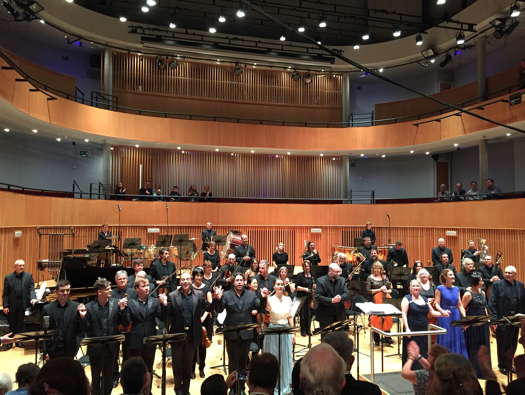 Conductor Kenneth Woods (centre) with soloists and the English Symphony Orchestra on completion of Joubert's 'Jane Eyre' in Birmingham UK