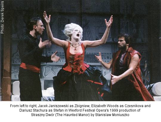 From left to right, Jacek Janiszewski as Zbigniew, Elizabeth Woods as Czesnikova and Dariusz Stachura as Stefan in Wexford Festival Opera's 1999 production of Straszny Dwór (The Haunted Manor). Photo: Derek Speirs