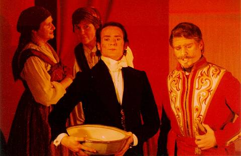James Edwards (right, in red) as the Polish Swordbearer Miecznik and William Molesworth (left, in black) as the tiresome suitor Damazy in the 2001 Opera Omnibus production of Stanislaw Moniuszko's 'The Haunted Manor'