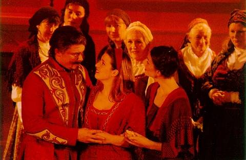 The sisters Hanna (Saffron van Zwanenburg. centre) and Jadwiga (Maria Jones, right) with their father Miecznik (James Edwards, left) in Opera Omnibus's 2001 production of Moniuszko's 'The Haunted Manor' at Haslemere Hall, Surrey
