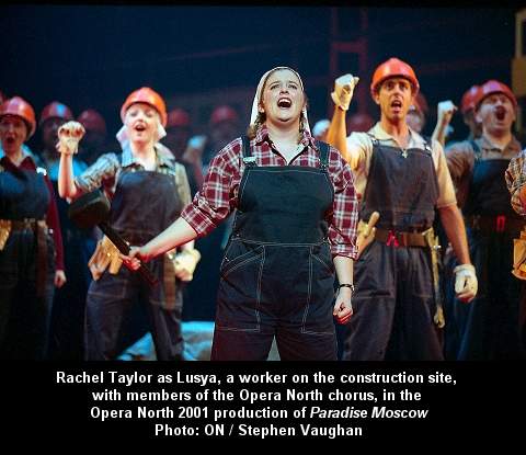 Rachel Taylor as Lusya, a worker on the construction site, with members of the Opera North chorus, in the Opera North 2001 production of 'Paradise Moscow'. Photo: ON / Stephen Vaughan