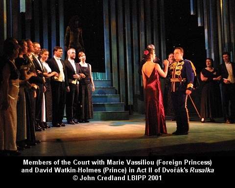 Members of the Court with Marie Vassiliou (Foreign Princess) and David Watkin-Holmes (Prince) in Act II of Dvorák's 'Rusalka', designed by Ian McKillop. © John Credland LBIPP 2001