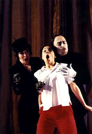 Ann Taylor (left), Claire Wild as The Child (centre) and Richard Burkhard in the Opera North 2002 production of Ravel's 'L'Enfant et les Sortileges'. Photo: Bill Cooper