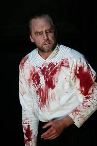 Anthony Michaels-Moore as a bloodied Macbeth following Duncan's murder. Photo: Performing Arts Library