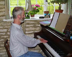 Sainsbury at the piano in his Oxfordshire home. Photo: Keith Bramich
