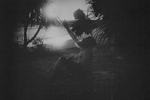 Enoch on the island 'under a palm tree' - a still from the 1915 film by D W Griffith and Christie Cabanne