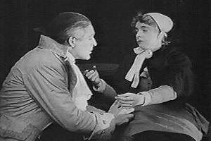 Philip pleads with Annie, in the 1915 film 'Enoch Arden'