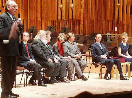 Lord Birkett (left), announcing the winner of the 2002 Donatella Flick Conducting Competition with, from left to right, Mauro Bucarelli, Leif Segerstam, Vassily Sinaisky, Jane Glover, Andrew Marriner, The Duke of Kent and Donatella Flick. Photo: Keith Bramich
