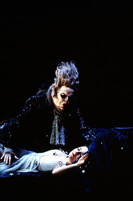 Adrian Thompson as Monostatos with Pamina (Dorothea Röschmann). Photo © 2003 Catherine Ashmore/Performing Arts Library