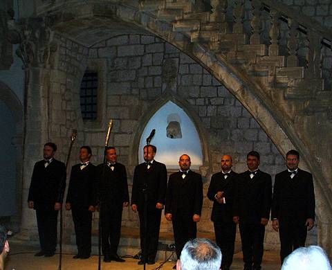 The Slovene Octet acknowledging applause at the end of their concert in the visually striking Rector's Palace Atrium at the 2003 Dubrovnik Festival. Photo © 2003 Keith Bramich