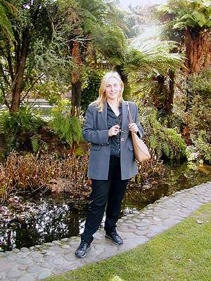 Sonja Radojkovic standing near to New Zealand native bush in Taumaranui. Photo © 2003 Howard Smith