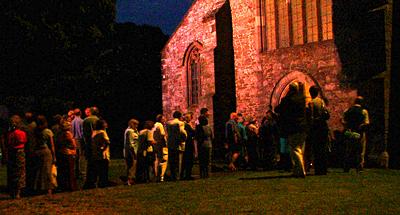 Interval drinks over, the audience begins to return to St Andrews Church. Photo: Keith Bramich