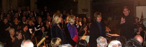 Acknowledgement for Cecilia McDowall at the first performance of her new Magnificat. Left to right: Ruth Peel, Rachel Nichols, Cecilia McDowall and George Vass, with members of the choir and orchestra behind. Photo: Keith Bramich