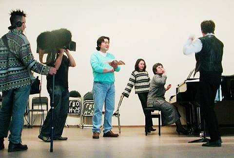 A British TV crew focuses in on Korean bass Heung Yong Choi during rehearsals. © 2003 Howard Smith