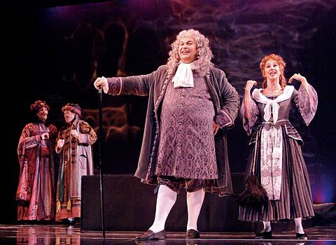 From left to right, Steven Mello (Ferrando), Scott Guinn (Guglielmo), Michael P Schmidt (Don Alfonso) and Kristen Plumley (Despina) in Lyric Opera Cleveland's Così fan tutte. Photo © 2004 Steve Zorc