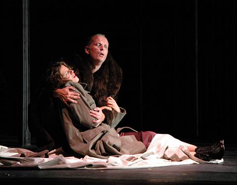 Tragedy strikes Rigoletto (Charles Johnston) who holds his dead daughter Gilda (Caroline Childe) in his arms in Mid Wales Opera's 2004 staging of Verdi's Rigoletto.