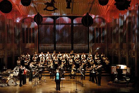 Betsy Burleigh leads the troops for the audience sing-along at the end of the concert. Photo © 2004 Roger Mastroianni