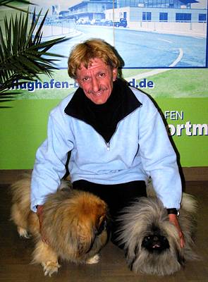 Love of music and dogs: Professor Ekard Lind with two exhibitors at the 2005 Dortmund International Dog Show. Photo © Philip Crebbin