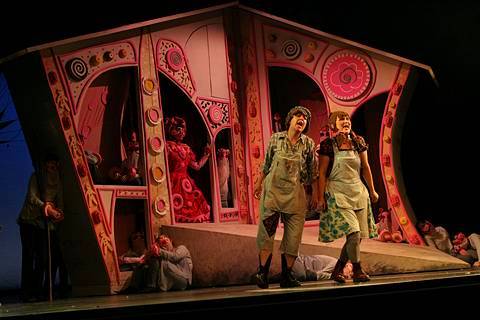 Jane Streeton as Gretel (right) and Maria Jagusz as Hansel in front of the Witch's house in Longborough's 'Hansel and Gretel'. Photo © 2005 Stephen Wright