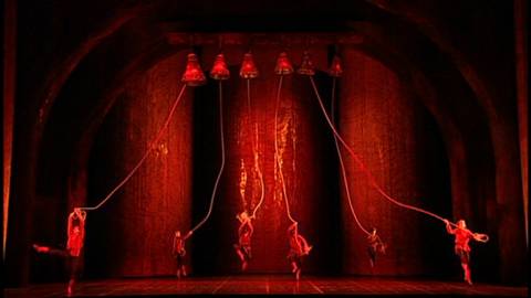 Bells ring to call the people to assemble (Act 1 Tableau 1). DVD screenshot © 2004 Opéra National de Paris