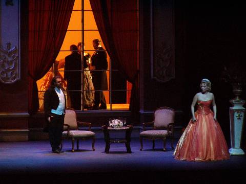 A scene from the Act 1 of Teatro Lirico d'Europa's 'La Traviata' at Newark, with Evgeny Akimov as Allfreo and Marina Viskvorkina as Violetta