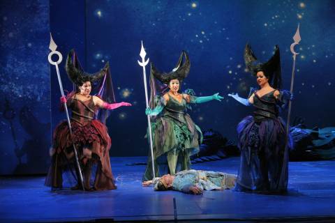 The Three Ladies, left to right, Barbara Divis, Priti Gandhi and  Lisa Agazzi, stand over Tamino (Rainer Trost) in San Diego Opera's production of Mozart's 'The Magic Flute'. Photo © 2006 Ken Howard