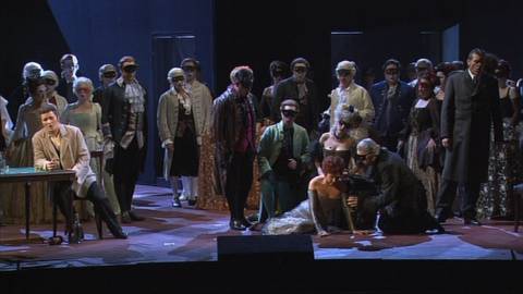 Eva Mei as Violetta, stricken, with the cast of 'La Traviata'. DVD screenshot © 2005 Zurich Opera House