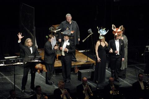 From left to right, Vladimir Chernov (as Ford, with hand raised). Scott Scully (Bardolfo, face covered by veil), Max René Cosotti (Dr Caius, with rat headpiece), Richard Sutliff (Falstaff, above Dr Caius), Cinzia Forte (Nannetta, with bird mask headpiece)  and Cataldo Caputo (Fenton, with fox headpiece) in Act III Scene 2 of 'Falstaff'. Photo © 2006 Roger Mastroianni