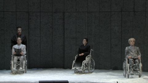 Waxworks in wheelchairs. DVD screenshot © 2004 Opernhaus Zürich