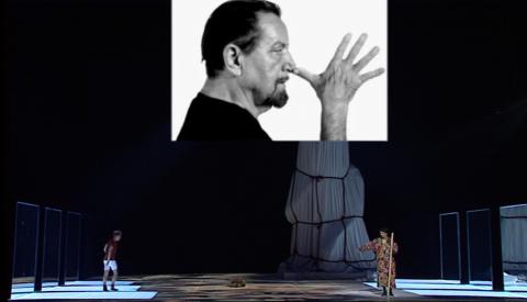 A scene from the Maurice Béjart's 'The Nutcracker', with the projected image of Maurice Béjart. DVD screenshot © 2000 RM Associates
