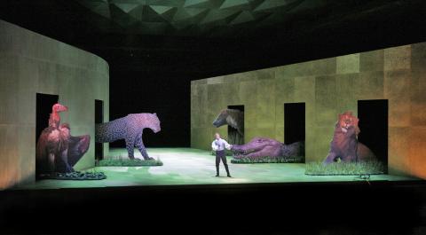 Toby Spence (Tamino) and the animals in the Santa Fe Opera production of 'The Magic Flute'. Photo © 2006 Ken Howard
