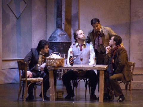 Rodolfo (Gabriel Gonzalez), Colline (Mikhail Kolelishvili), Shaunard (Ilia Pavlov) and Marcello (James Bobick) in Act I of 'La bohème'. Photo © 2006 Robin Grant