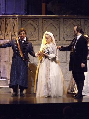 Lucia (Larissa Yudina), Enrico (Theodore Lambrinos) and Raimondo (Mikhail Kolelishvili) in the 'Lucia di Lammermoor' wedding scene. Photo © 2006 Robin Grant