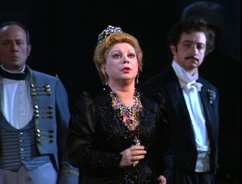 Fedora (Mirella Freni) holds the cross containing the phial of poison. DVD screenshot © 1993 Radiotelevisione Italiana