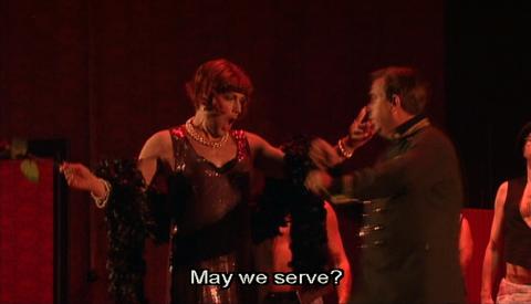 Franz Hawlata as Baron Ochs with the 'transvestite keeper of the establishment'. DVD Screenshot © 2004 ORF