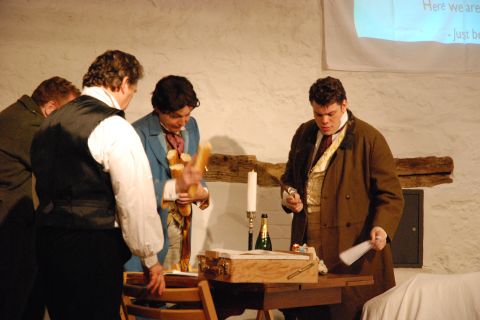 Colline (hidden, at rear), Marcello, Schaunard and Rodolfo in their sparsely furnished students' garret. Photo © 2007 Sebastian Fattorini, Skipton Castle