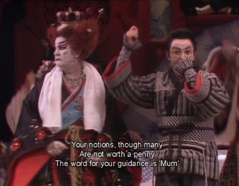 Katisha (Heather Begg, left) and Ko-Ko (Graeme Ewer) at the end of Act II. DVD screenshot © 1987 The Australian Opera