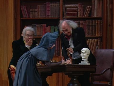 The 'marriage' scene: Don Pasquale (Ferrucio Furlanetto), 'Sofronia' (Nuccia Focile) and the notary (Claudio Giombi). Screenshot © 1994 RAI Trade 