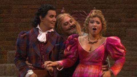 From left to right: Saimir Pirgu as Edoardo Milfort, Fabio Maria Capitanucci as Slook and Désirée Rancatore as Fanny, in Rossini's 'La Cambiale di matrimonio'. Screenshot © 2008 Naxos Rights International Ltd