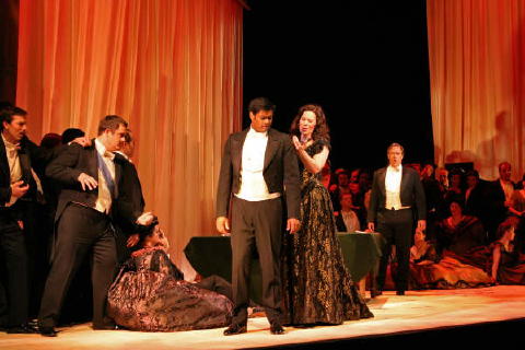 Sean Panikkar (Alfredo) and Alexandra Deshorties (Violetta) with Stephen Powell (Germont), James Flora (Gastone) and members of the Arizona Opera Chorus in the gambling scene (Act II Scene 2) from 'La Traviata'. Photo © 2008 Scott Humbert