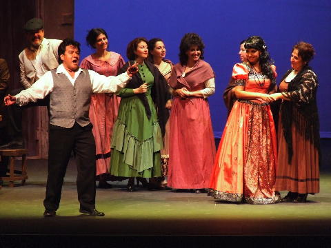 Gabriel Gonzalez as Turiddu with chorus. Lola (Snejana Dramcheva) and Svetomira Gitsova (Mama Lucia) are at the far right. Photo © 2008 Robin Grant