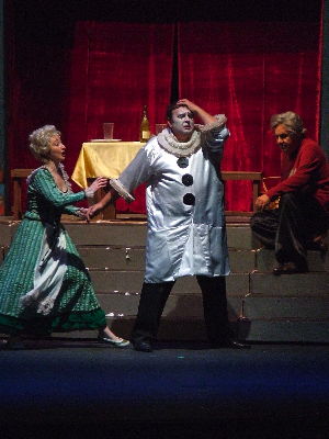 Pagliacci: Christin Molnar as Nedda pleads with her husband Canio, played by Viorel Saplacan, as Tonio (Theodore Lambrinos) looks on. Photo © 2008 Robin Grant