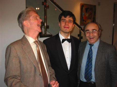 Andrejs Osokins is congratulated by jury member Malcolm Troup and master of ceremonies Alberto Portugheis. Photo © 2008 Harry Atterbury