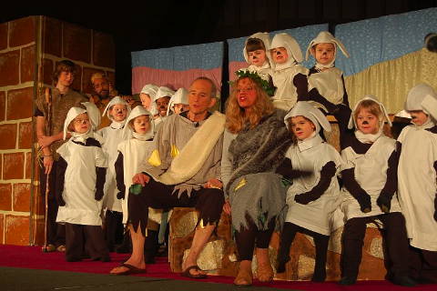 The Shepherd (Alan Coulter) and his wife (Terri Morris) with junior shepherds and sheep
