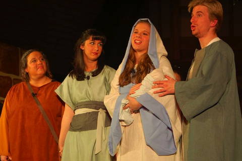 Julie Kerr as the widow, Alyssa Hensel as Miriam, Sarah Morris as Mary (with baby) and Andrew Boag as Joseph