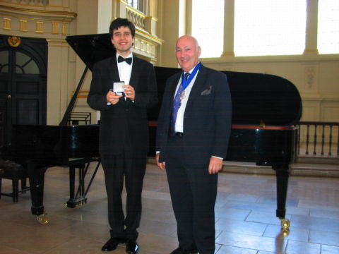 Senior Warden Maurice Summerfield (right) presenting the Worshipful Company of Musicians' Beethoven Medal to Andrejs Osokins at St Martin-in-the-Fields on 1 May 2009. Photo © 2009 Harry Atterbury