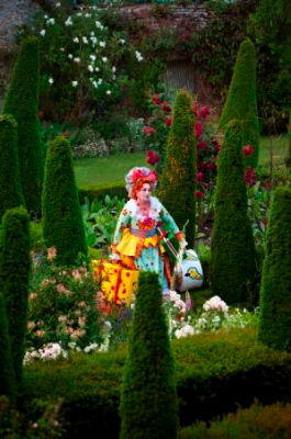 Jean Rigby's Deianira emerges, aptly, from Garsington's Italian garden. Photo © 2009 Johan Persson