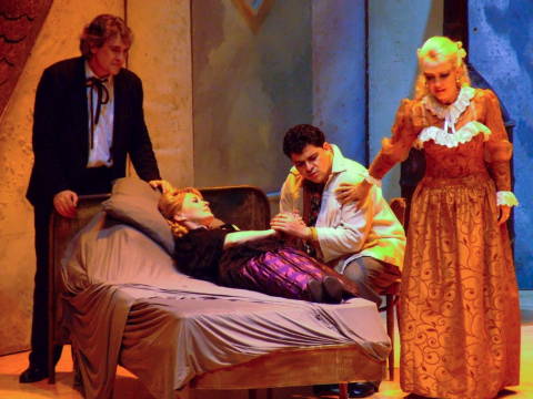 Rodolfo (Orlin Goranov), Marcello (Marian Jovanovski) and Musetta (Snejana Dramcheva) try to assist the dying Mimi (Elena Razgylaeva). Photo © 2009 Robin Grant