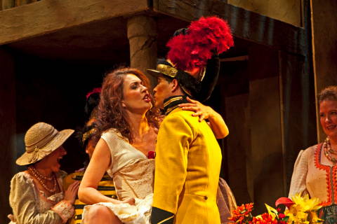 Carmen, Viktoria Visin, flirts with a soldier in the Phoenix Opera production of Bizet's 'Carmen'. Photo © 2009 Victor Massaro